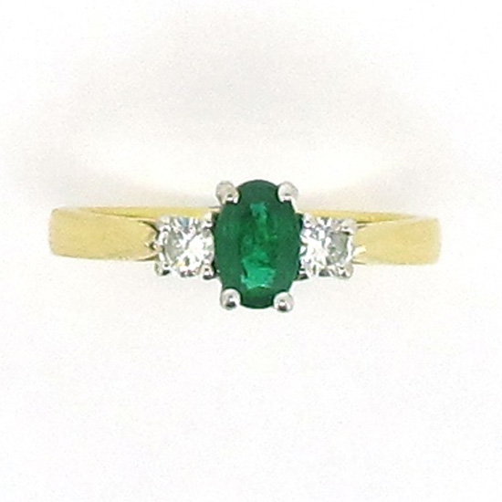 emerald and diamond three stone ring