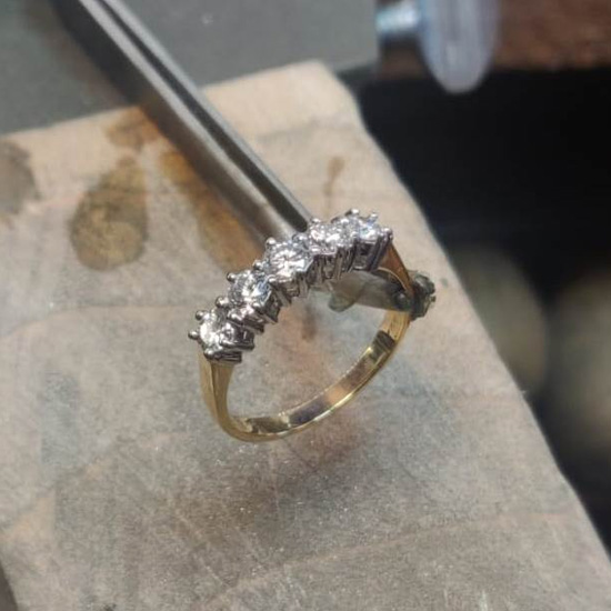 Fixed diamond ring with new stone replacement